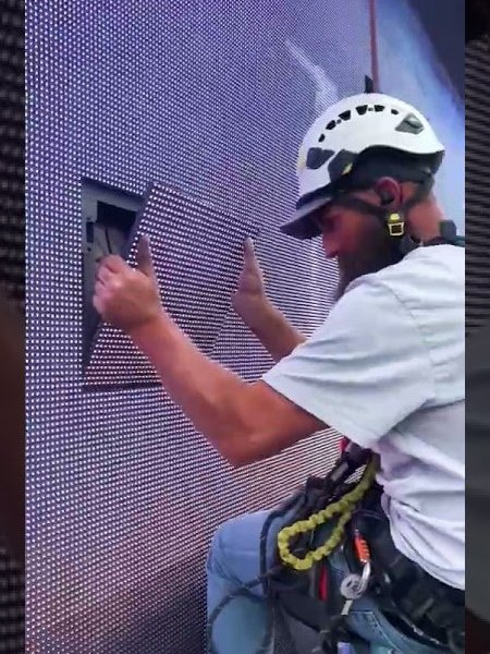Skyworks Unlimited rope access technician in harness at height
